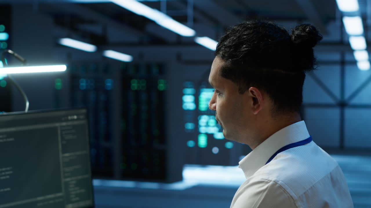 Jolly IT expert doing maintenance on server room infrastructure