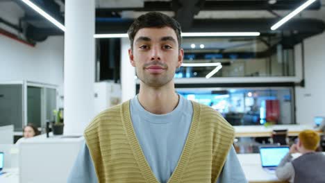 portrait of young handsome businessman in casual outfit in the office