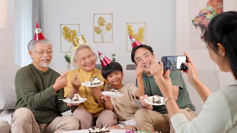 a joyful family gathers to celebrate a birthday, sharing cake and smiles in a warmly lit room