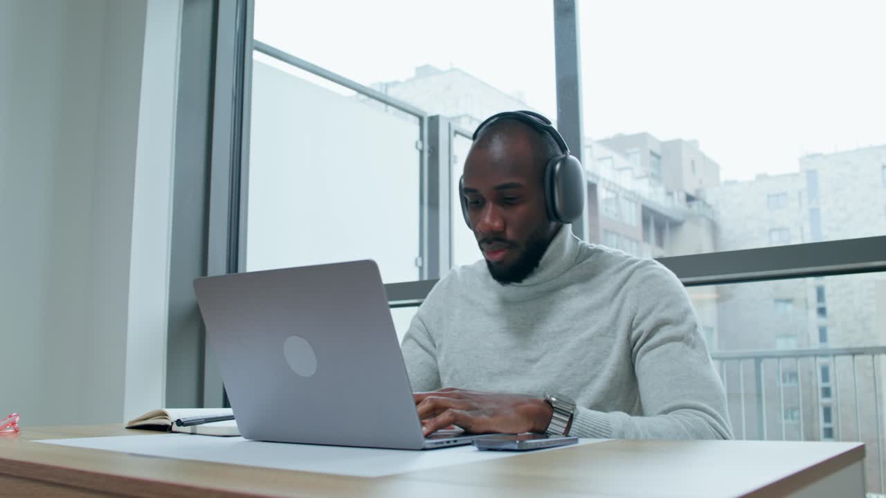 Man Working From Home on Laptop