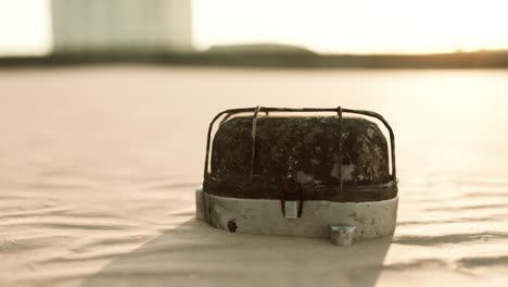 old rusted trash on the sand beach