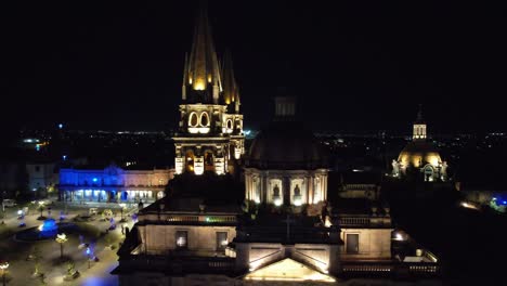 Guadalajara-Night-Aerial-Pan-Up-to-Catedral-de-Guadalajara