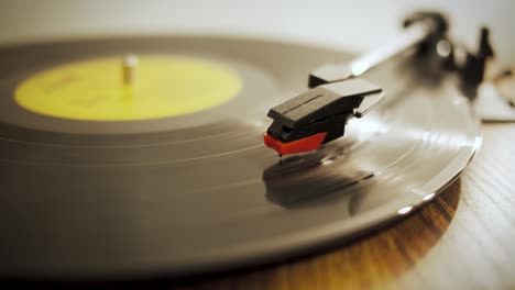 Record-rotates-on-a-retro-wooden-turntable---Slow-camera-panning