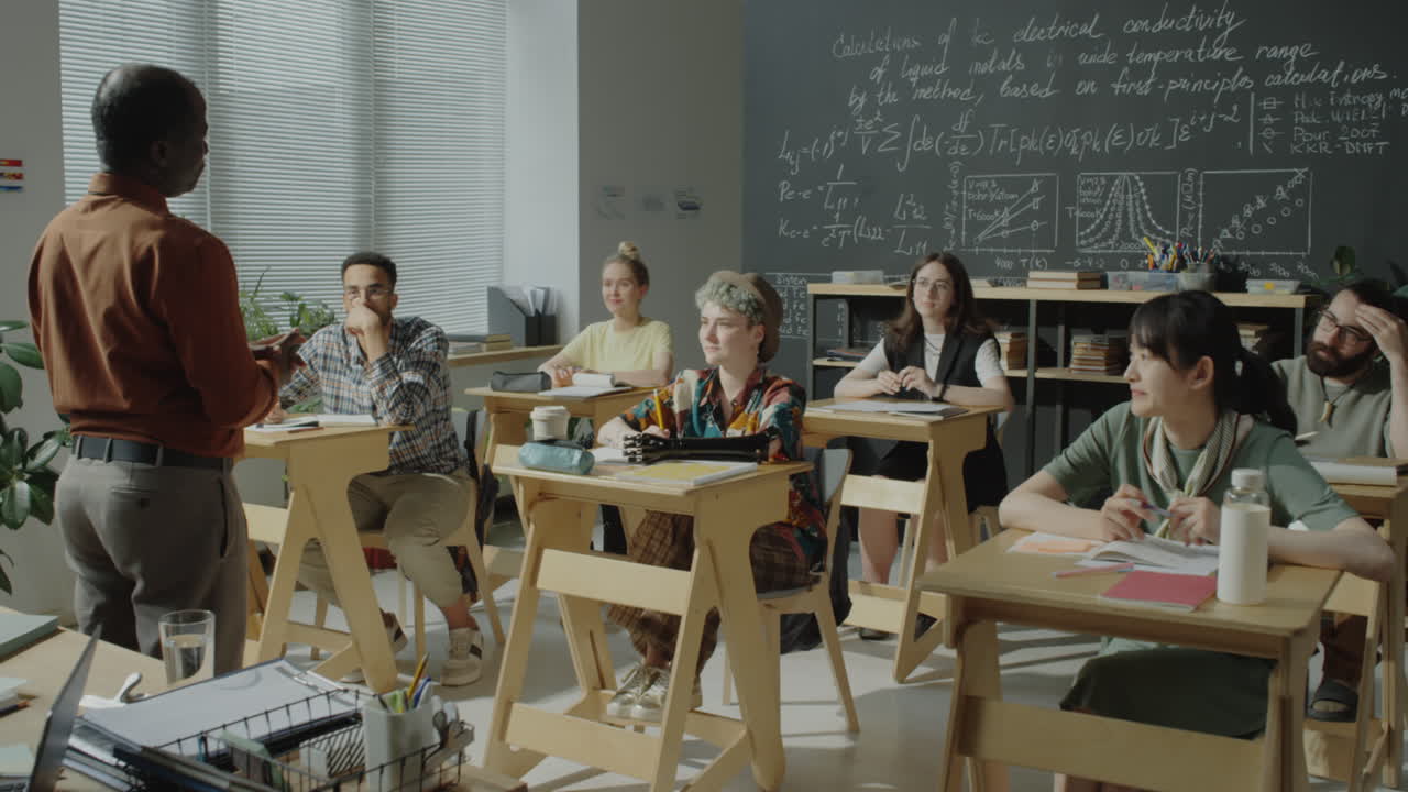 Teacher lecturing diverse students in a university classroom