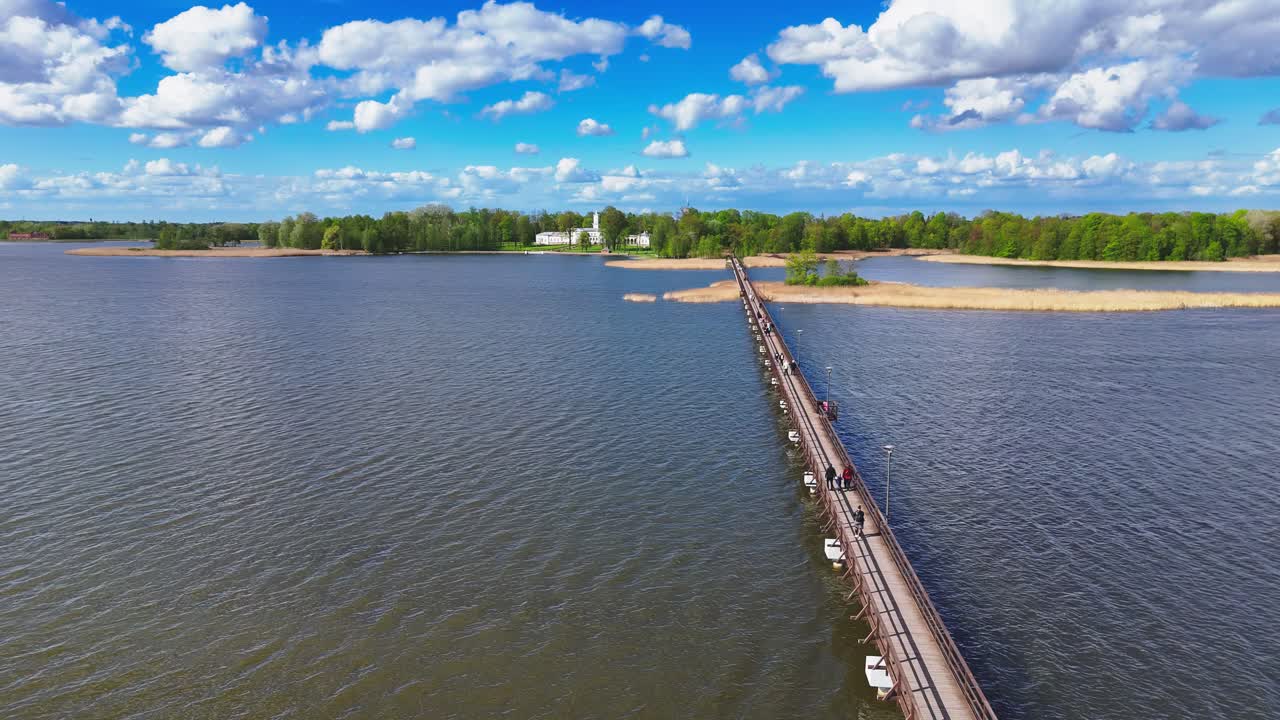 Observing Lake Sirvėna and Birzai's famous longest wooden bridge from a drone's flight path