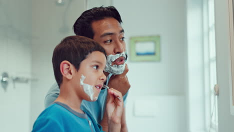 dad, boy and learning to shave in bathroom