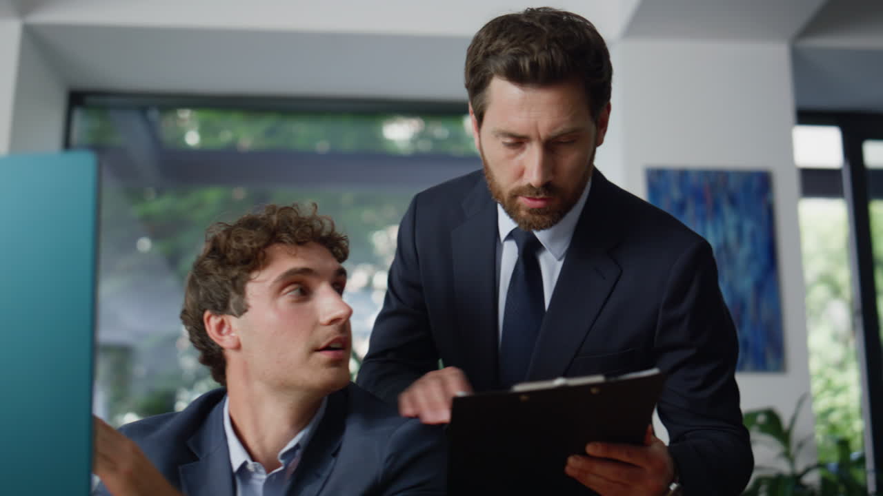 Coworkers discussing business plan corporate office closeup. Men looking monitor