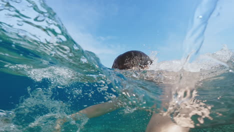 swimming frog style on the ocean