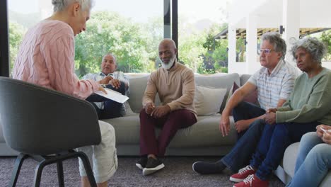 senior diverse people at meeting talking at retirement home
