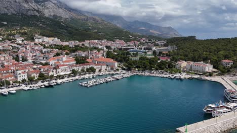 Drone aerial view of makarska harbour town city croatia balkan country balkans Biokovo mountains