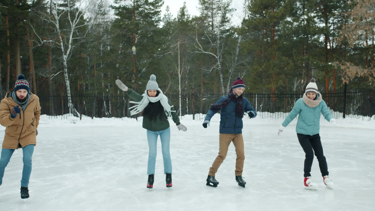 Friends Ice Skating Outdoors in Winter