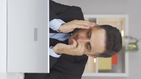 vertical video of home office worker man nervously waiting at laptop.