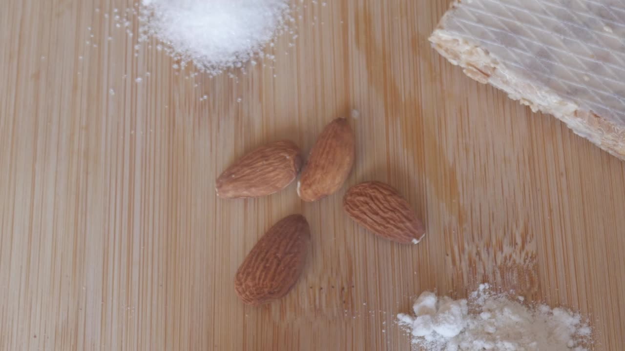 Almonds and ingredients for making Spanish Christmas turron