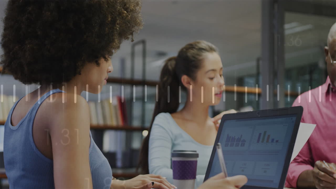 Business data charts animation over diverse team working in modern office