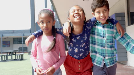 in school, group of children walking together and smiling during recess