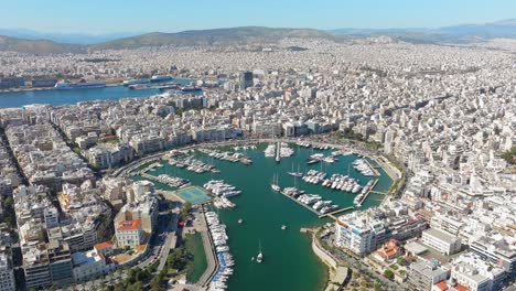 Scenic-view-of-marina-Zeas-or-Pasalimani-with-cityscape-in-background,-Athens