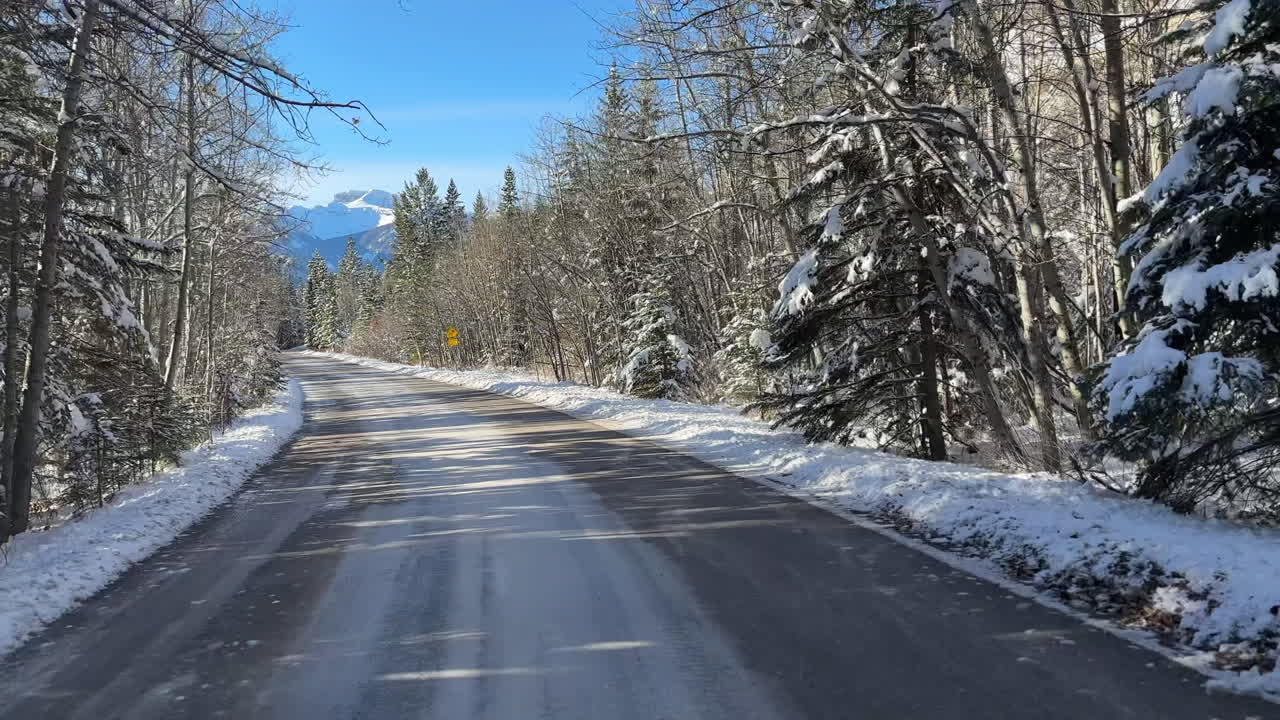 Driving in winter in the mountains. POV.