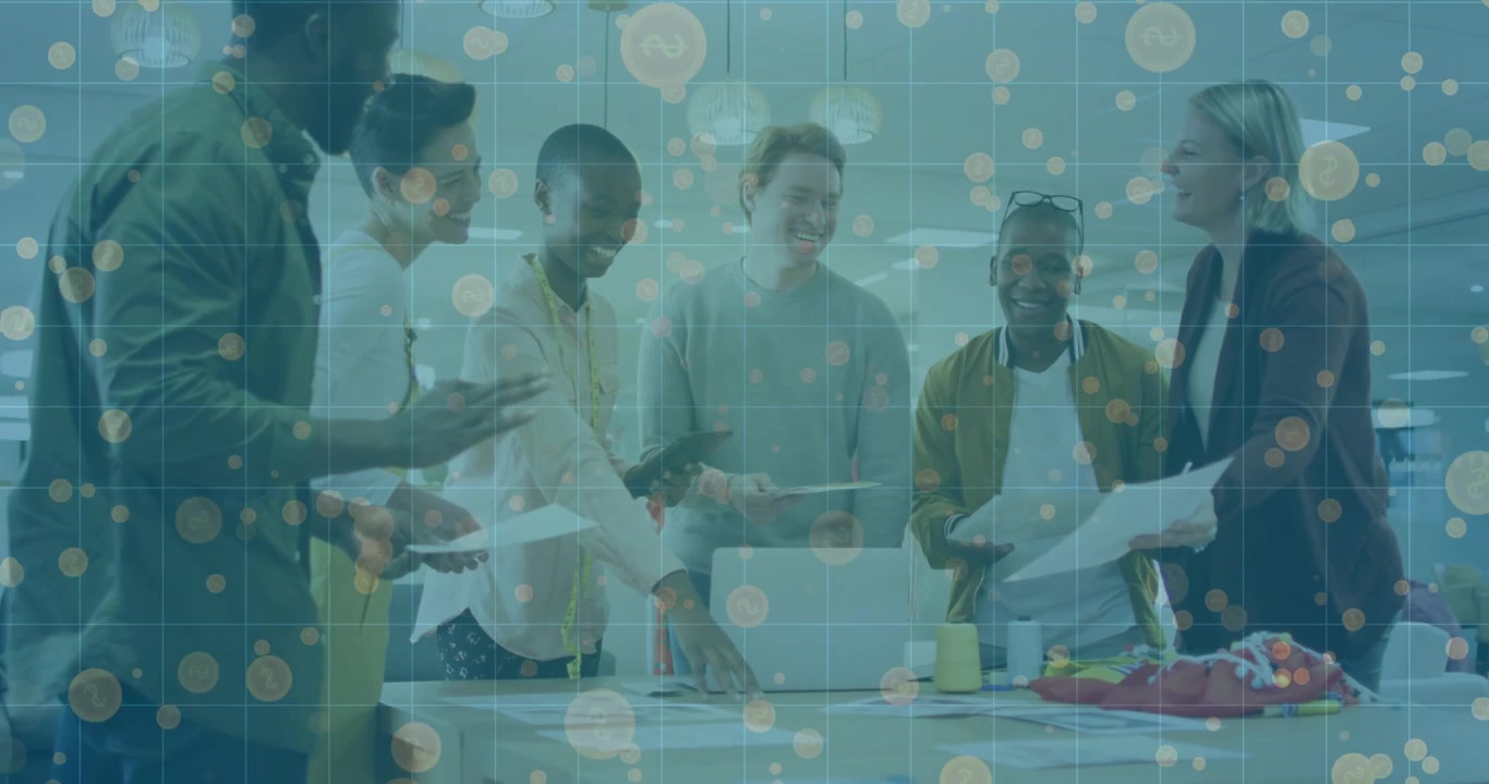 Man gesturing at mockups sparking design work team passing docs confetti rising in business meeting