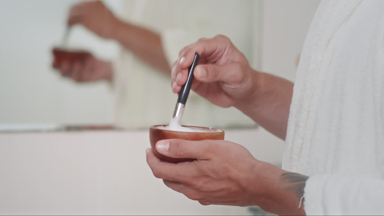 Hands of Man Mixing Shaving Foam in Bowl with Brush