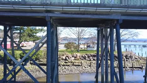 under and through bridge beams to park in bay on slough