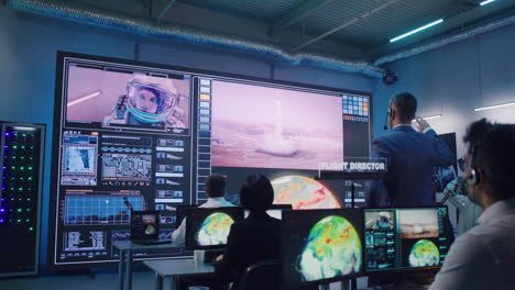 space mission control team celebrating success