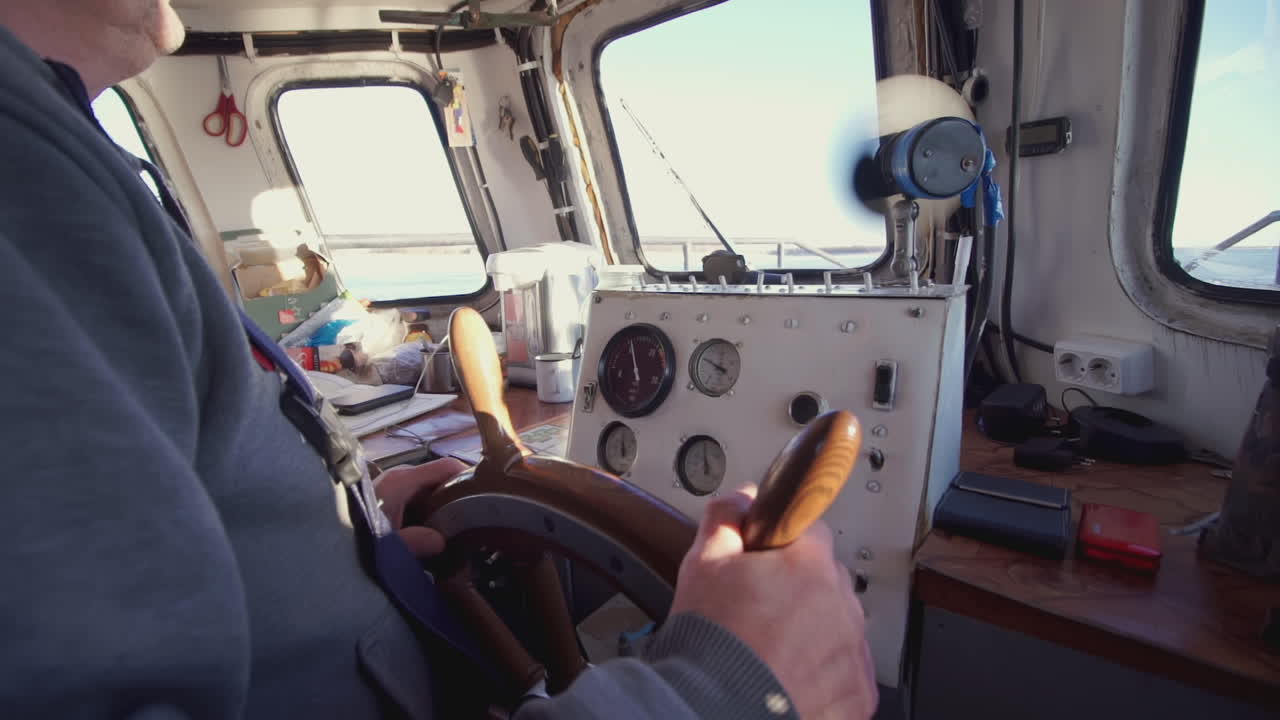 Boat Captain at the Helm