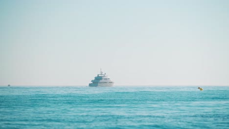 luxury yacht on the mediterranean sea moving away from the coast