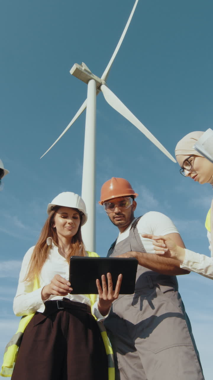 Engineers examining wind turbine