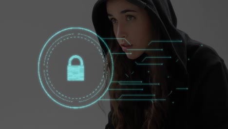 security padlock icon against female hacker using laptop