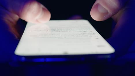 Closeup-Of-Young-Man-Hands-Scrolling-Phone-Screen