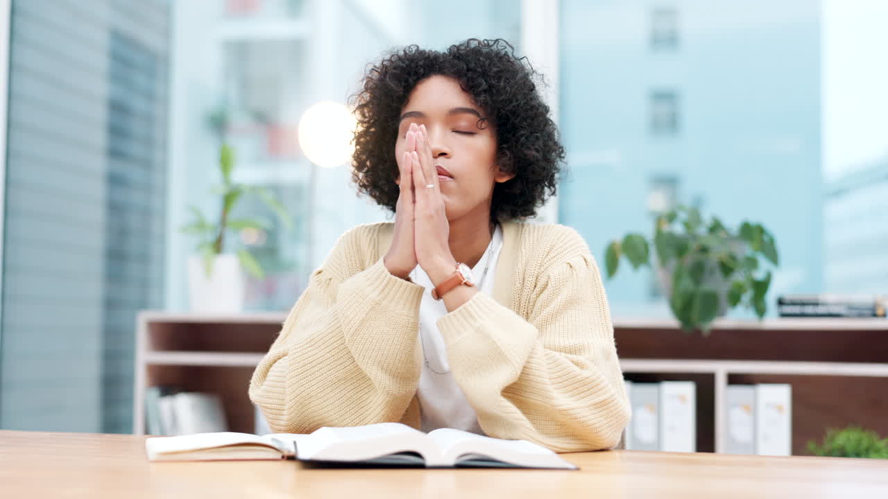 Bible, praying and business woman in office
