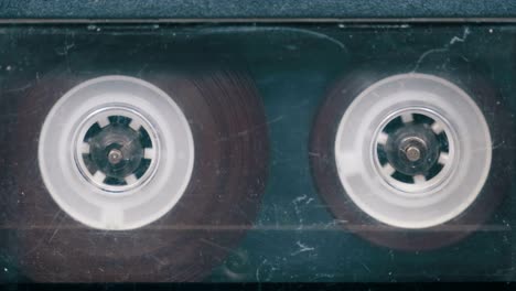 the vintage audio cassette in the tape recorder rotates