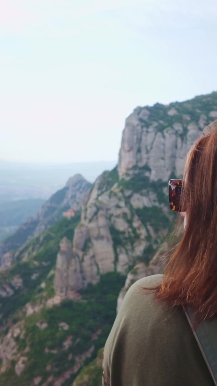 Woman admiring the Montserrat mountain range in Spain