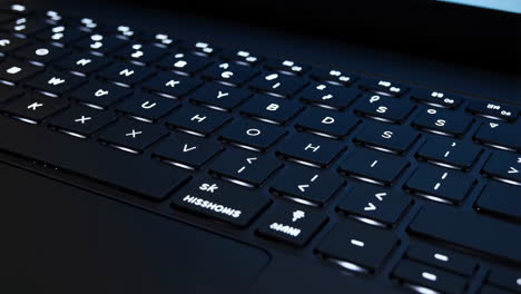 close-up of a backlit laptop keyboard