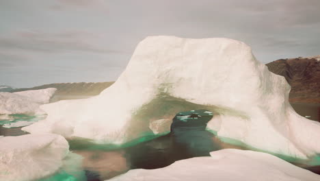 large iceberg with a hole in it