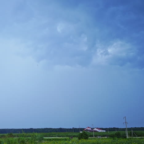 set of beautiful lightning strikes on blue background. small electrical lightnings in the sky over the green nature in the evening.