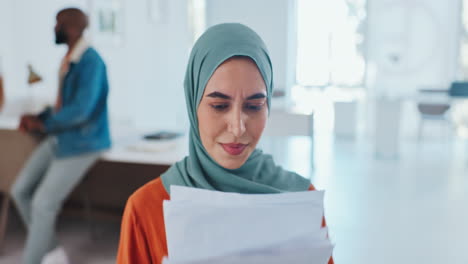 Muslim-business-woman,-reading-and-documents