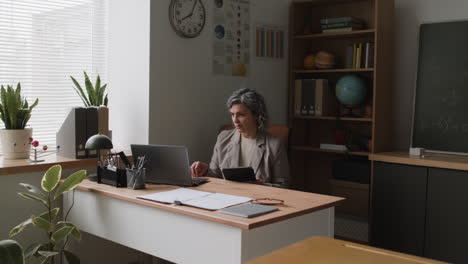 teacher working in a classroom