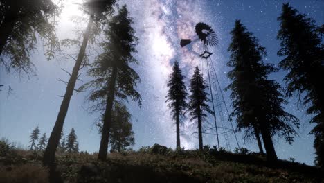 retro windmill in mountain forest