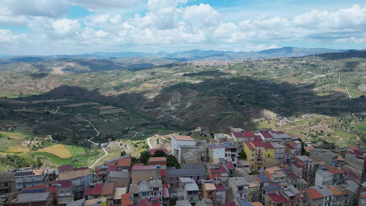 Aerial drone footage of Sant’Angelo Muxaro, Sicily: hilltop village surrounded by valleys and nature, rich in ancient history and rural charm. Perfect for travel, culture, and documentary projects