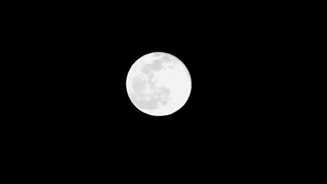 Plane-Flying-In-Front-Of-Full-Moon-Leaving-Smoke-Trace---low-angle-shot