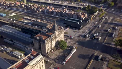 aerial shot revealing plaza san martin, retiro railway station and rio de la plata coast. tilt up