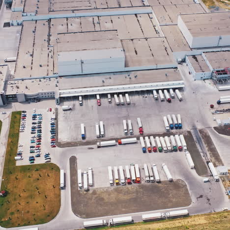 aerial view of warehouse with trucks. industrial background. logistics from above