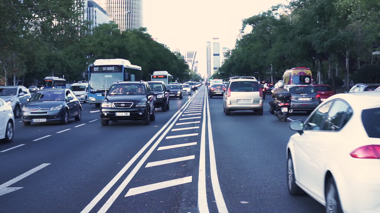 Video of Madrid city traffic during sunset. Heavy traffic at rush hour.