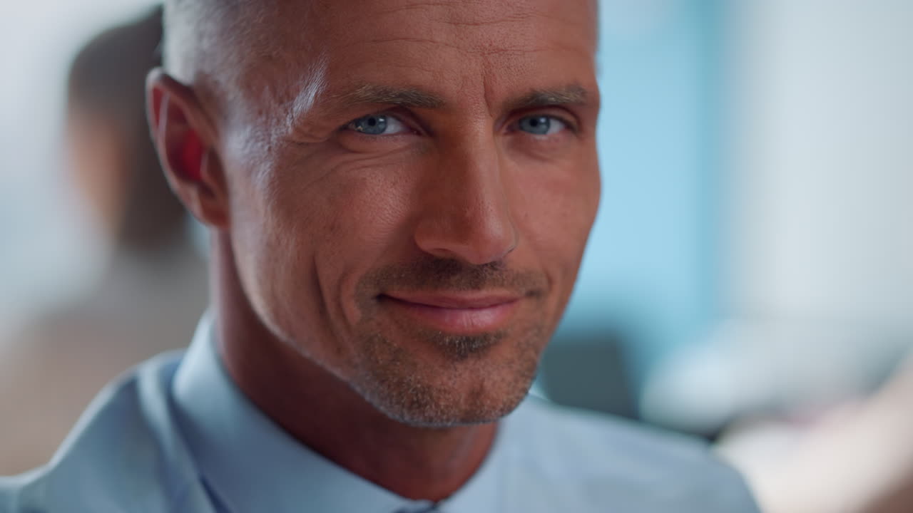 Closeup serious businessman posing at camera