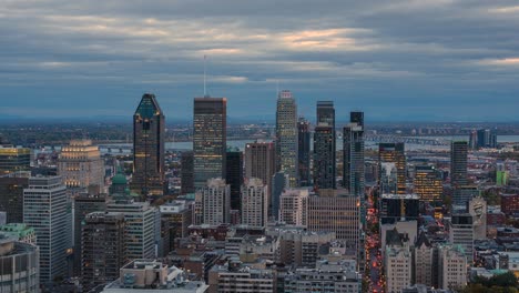 montreal, quebec, canada, day to night timelapse view of downtown montreal showing modern office buildings during fall season, zoom out