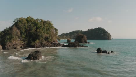 beautiful aerial of drone flying low over the beach of costa rica