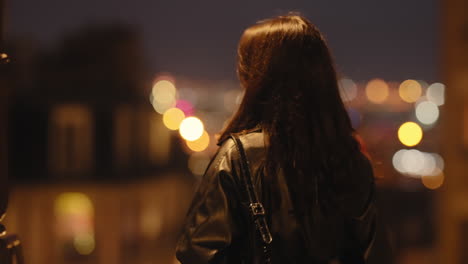 Beautiful-Woman-At-Night-In-Paris,-France-With-Bokeh-Lights-Backdrop