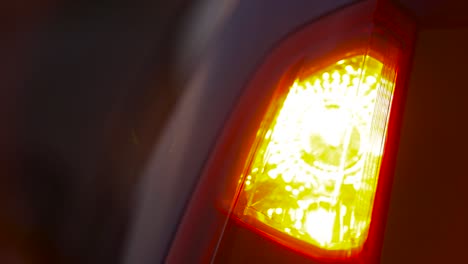 rear car hazard light at night - accident at bad conditions