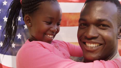 close up of american soldier is embracing his daughter